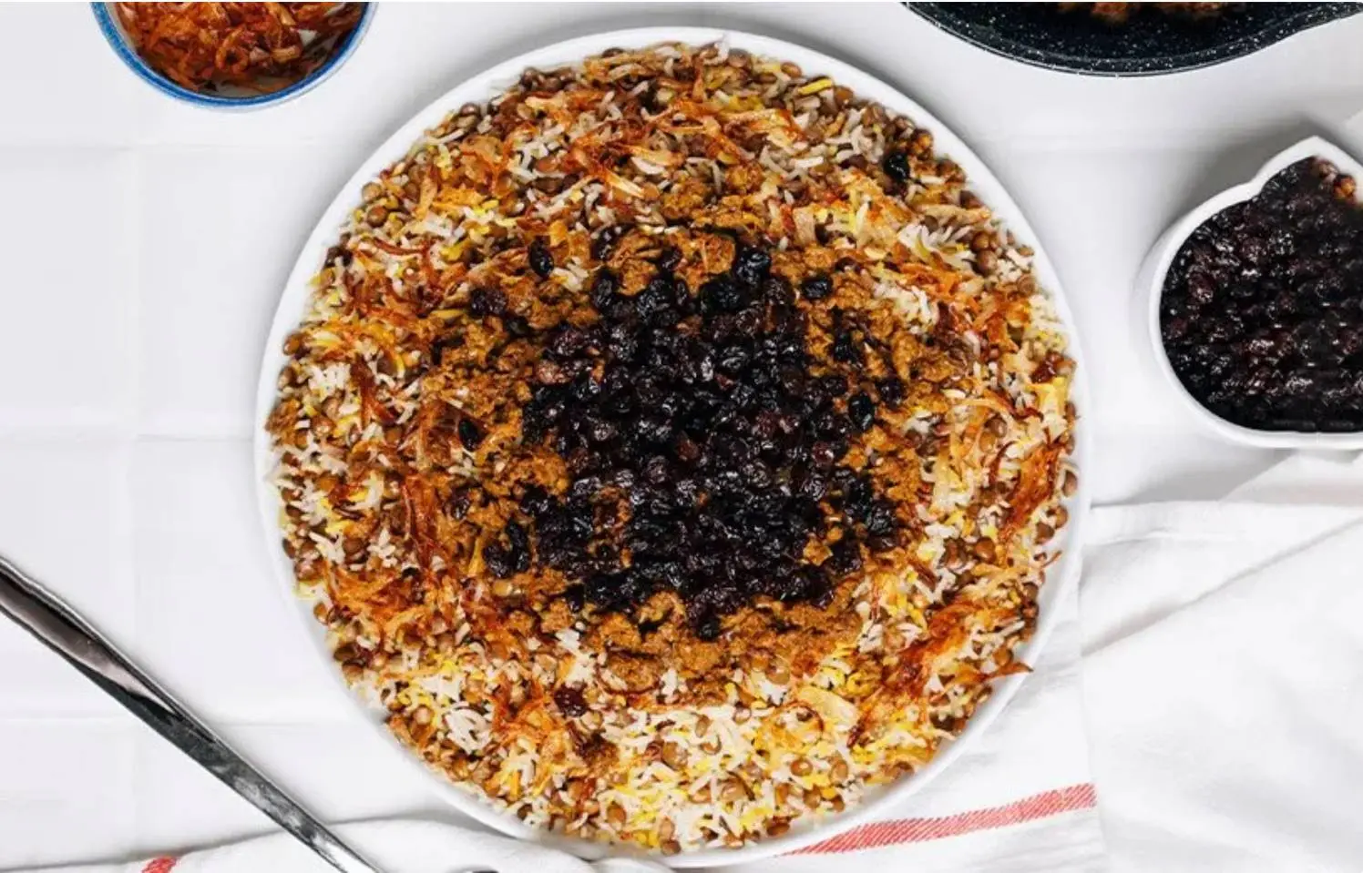 ناهار عدس پلو با کشمش و گوشت درست کن به روش سرآشپز| طرز تهیه عدس پلو مجلسی با گوشت و کشمش پلویی + نکات خاص