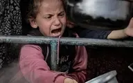 تصاویر بسیار غم انگیز از کودکان فلسطینی | تلاش برای گرفتن غذا +تصاویر