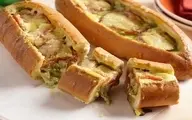 ساندویچ جادویی با خمیر پف‌دار و پنیر کشسان | طرز تهیه ساندویچ پیتزایی پر ملات +ویدئو